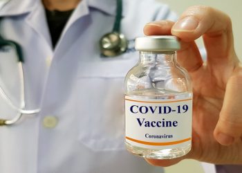 Doctor show COVID 19  vaccine for prevention and treatment new corona virus infection(COVID-19,novel coronavirus disease 2019 or nCoV 2019