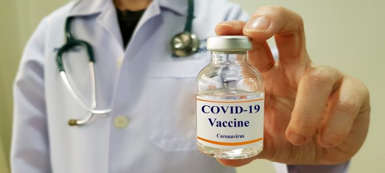 Doctor show COVID 19  vaccine for prevention and treatment new corona virus infection(COVID-19,novel coronavirus disease 2019 or nCoV 2019