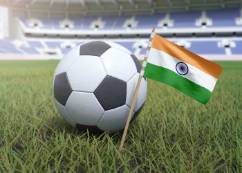 Indian flag in stadium field with soccer football